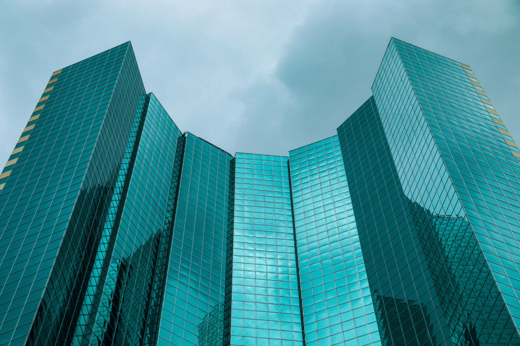 blue glass buildings towering towards the sky